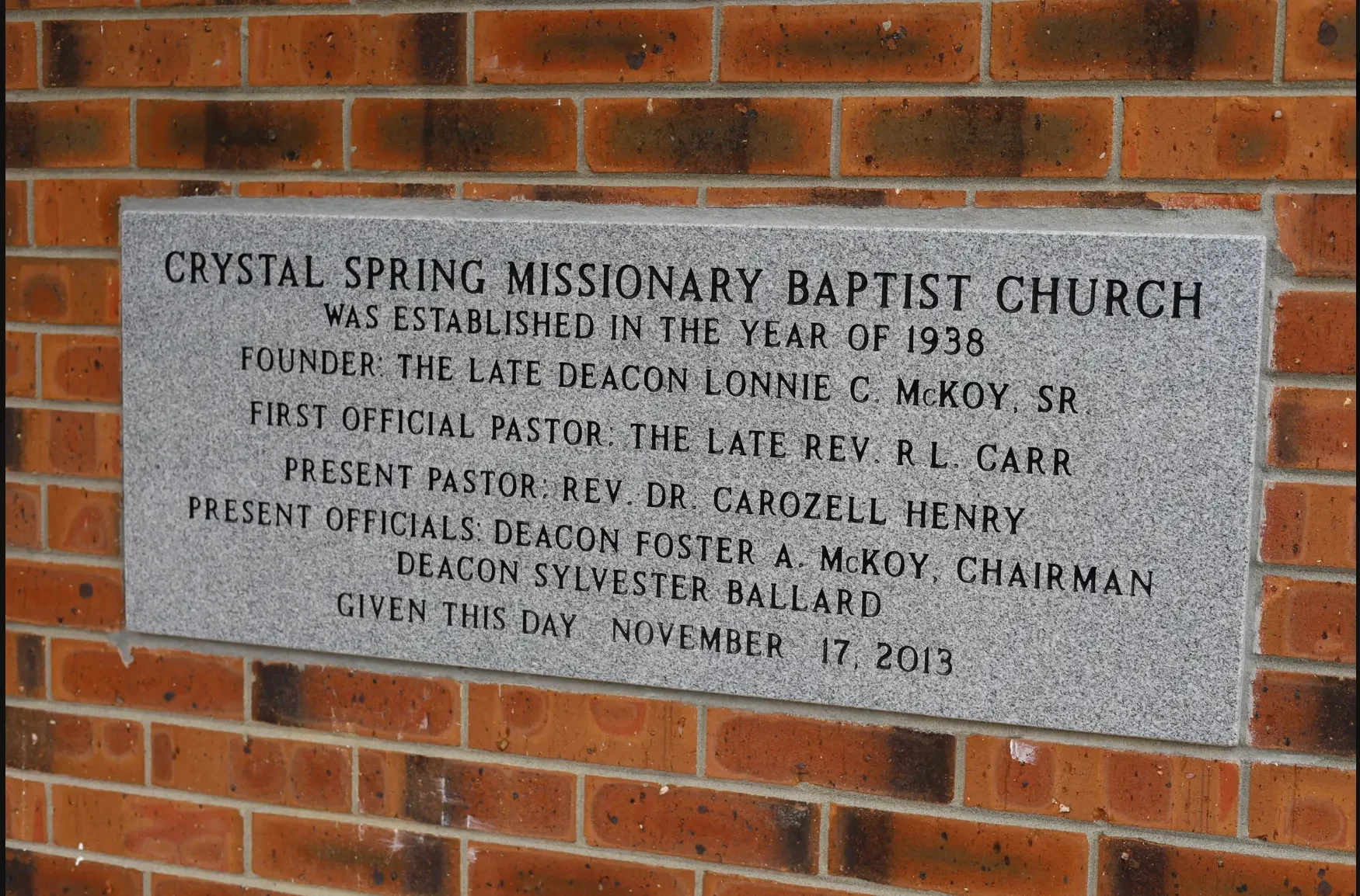 Granite commemorative plaque recording that Crystal Spring Missionary Baptist Church was established in 1938